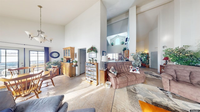 living room with an inviting chandelier, beam ceiling, high vaulted ceiling, and french doors