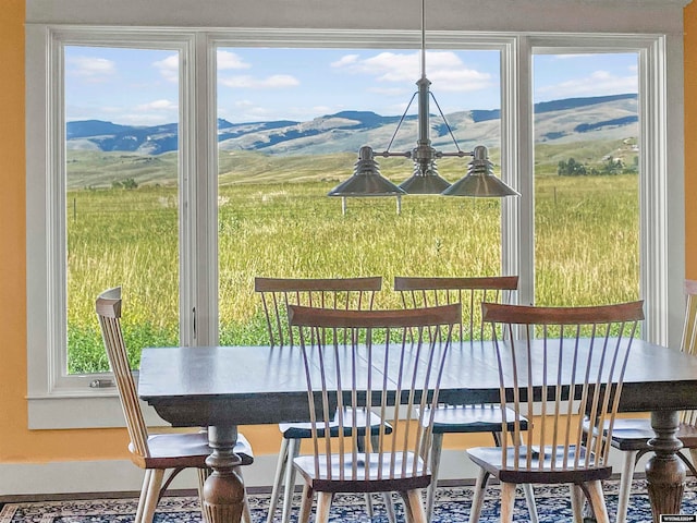 dining space with a mountain view