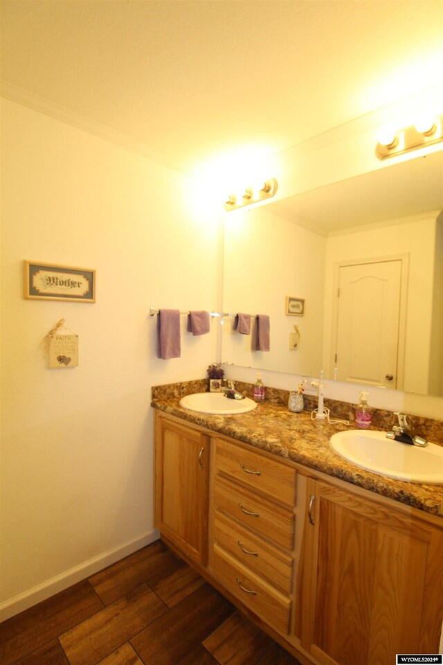 bathroom featuring hardwood / wood-style floors and vanity