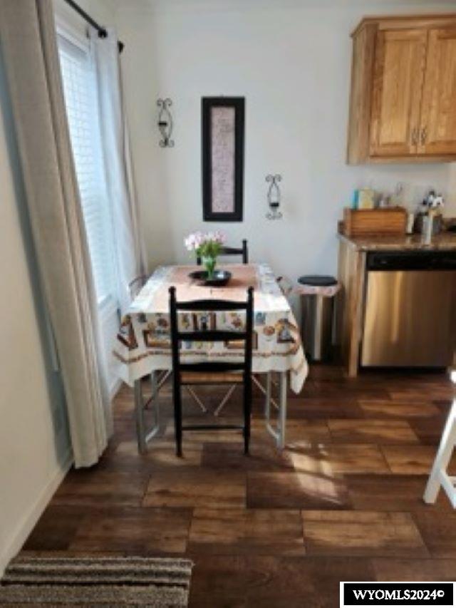 dining room with dark wood-type flooring