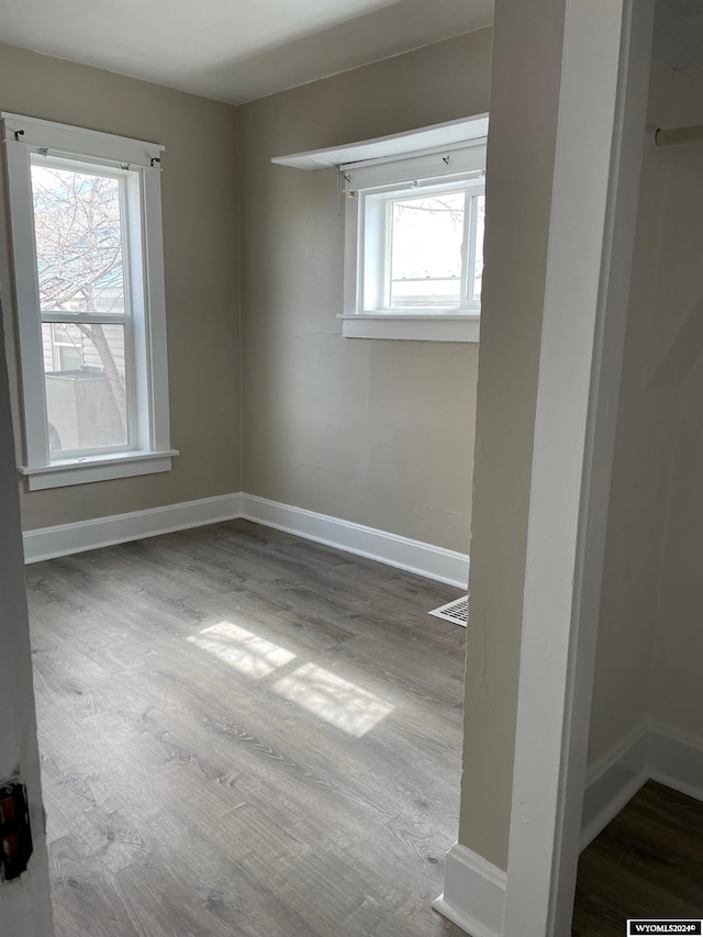 unfurnished room featuring dark hardwood / wood-style floors