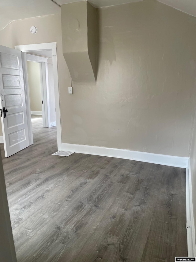 spare room with hardwood / wood-style flooring