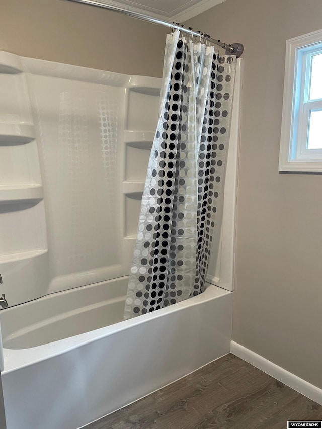 bathroom with shower / bath combo and wood-type flooring