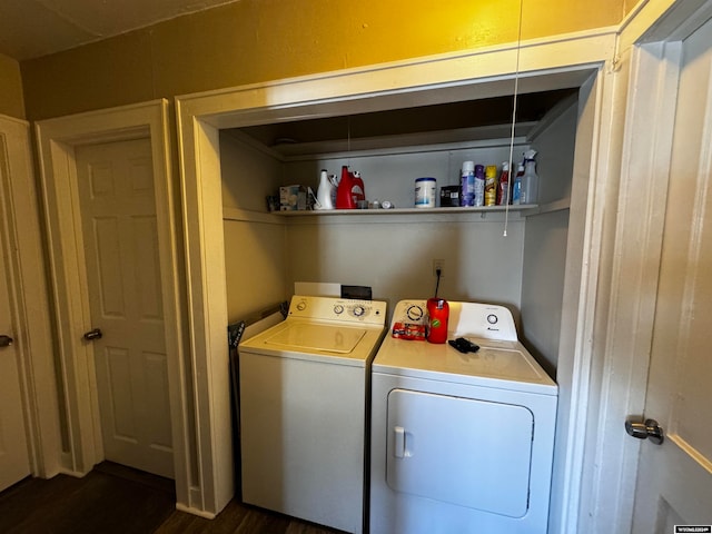 washroom with washer and dryer and dark hardwood / wood-style floors