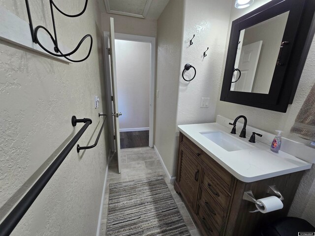 bathroom with tile flooring and vanity