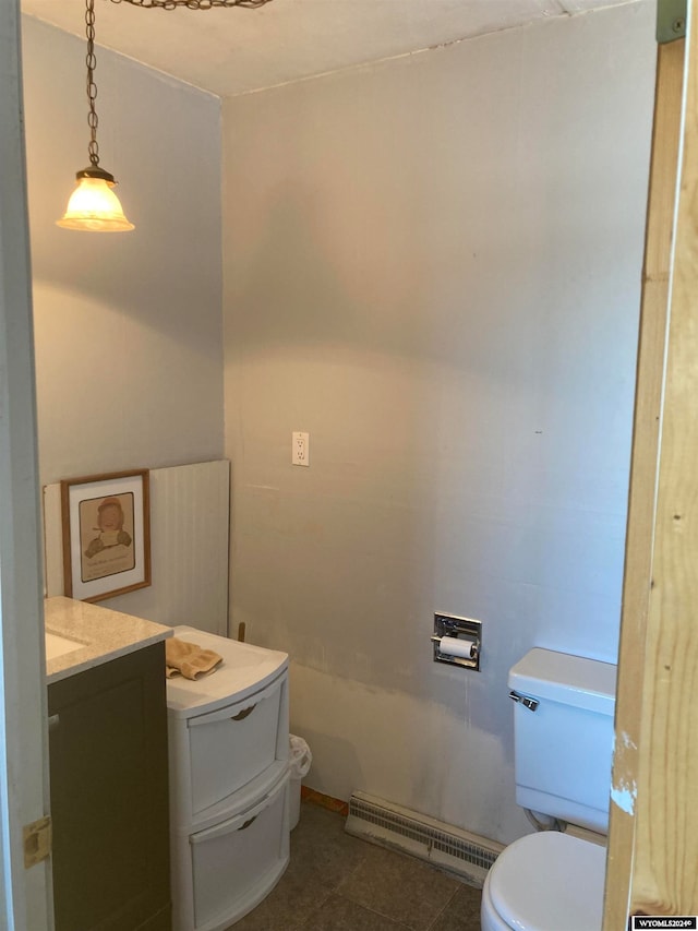 bathroom with a baseboard radiator, vanity, toilet, and tile flooring