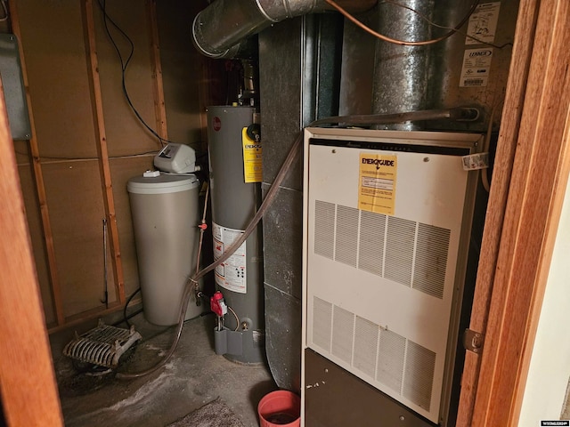 utility room featuring water heater