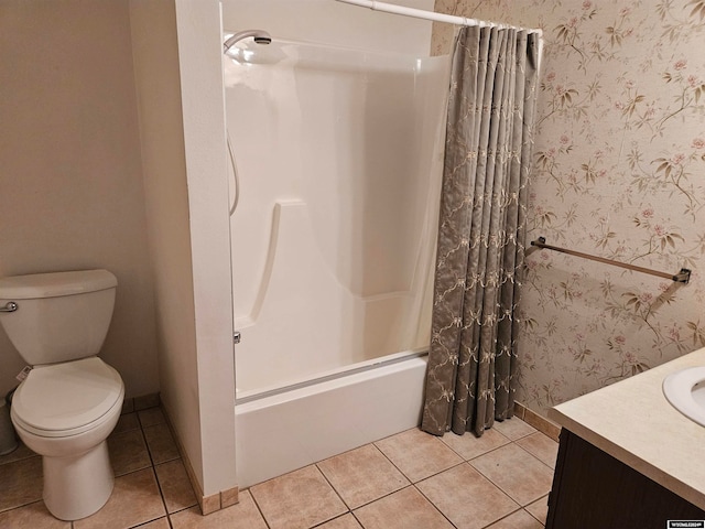 full bathroom with tile floors, shower / tub combo, vanity, and toilet