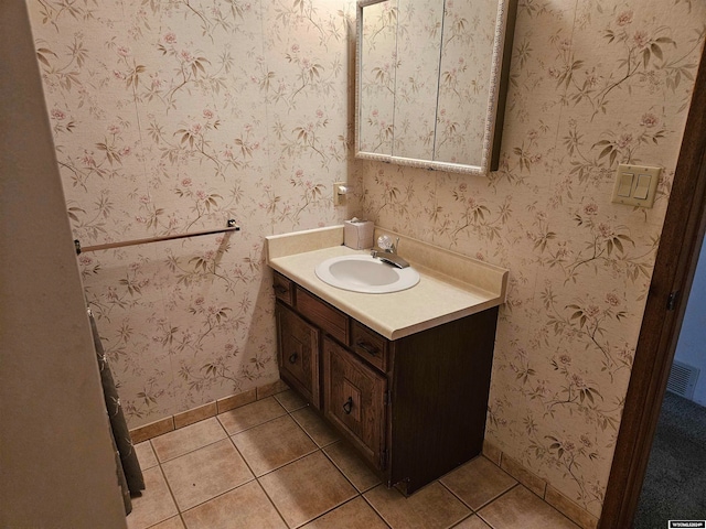 bathroom featuring tile floors and large vanity