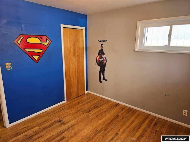 empty room with hardwood / wood-style floors