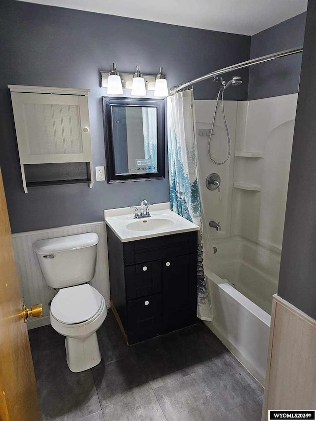 full bathroom featuring vanity, shower / bathtub combination with curtain, toilet, and tile flooring