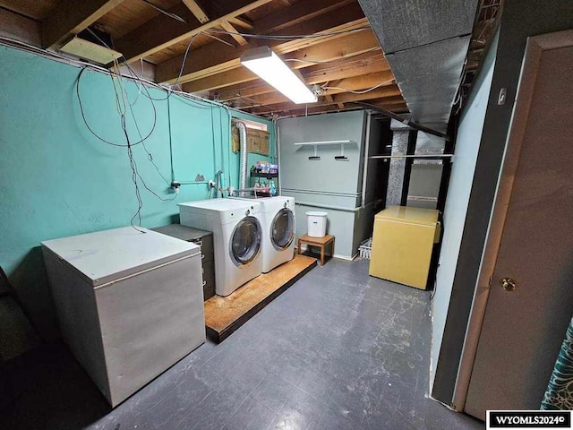 laundry area with washing machine and clothes dryer