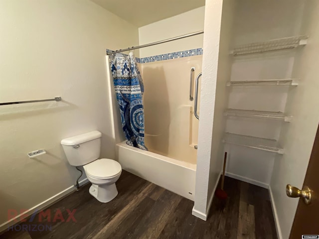 bathroom featuring hardwood / wood-style floors, shower / bath combination with curtain, and toilet