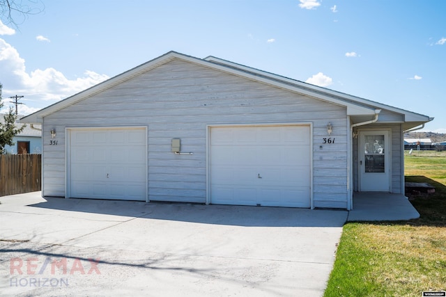 view of front of home with an outdoor structure and a garage