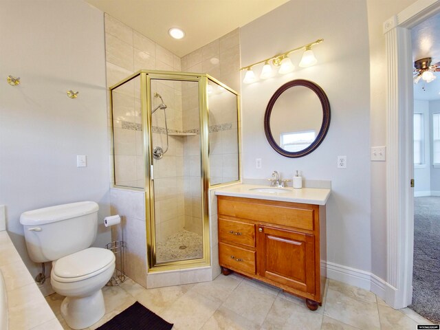 bathroom with vanity, toilet, and a shower with shower door