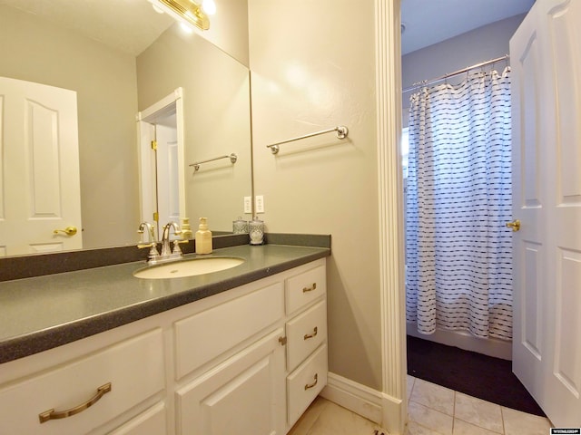 bathroom featuring tile patterned flooring, vanity, and shower / bath combination with curtain