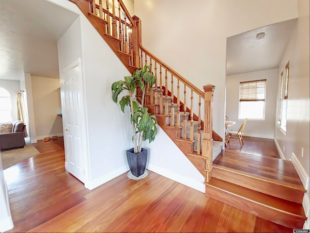 stairway featuring hardwood / wood-style flooring