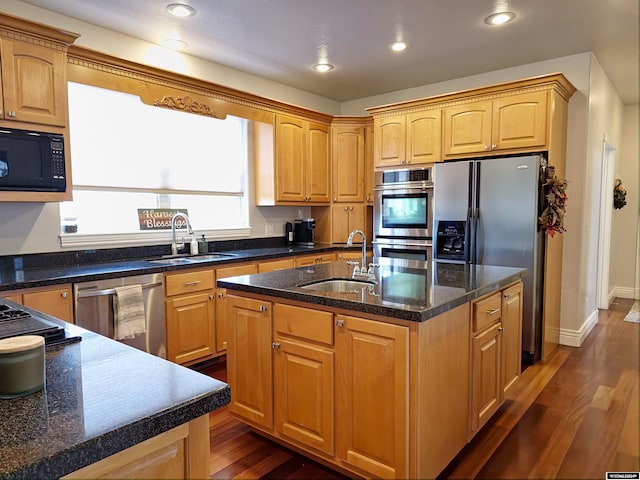 kitchen featuring sink, a center island with sink, and appliances with stainless steel finishes