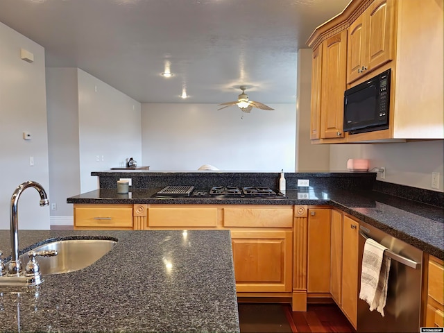 kitchen with ceiling fan, sink, dark stone counters, and black appliances