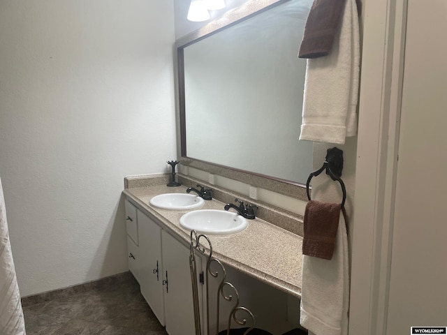 bathroom with tile floors and large vanity