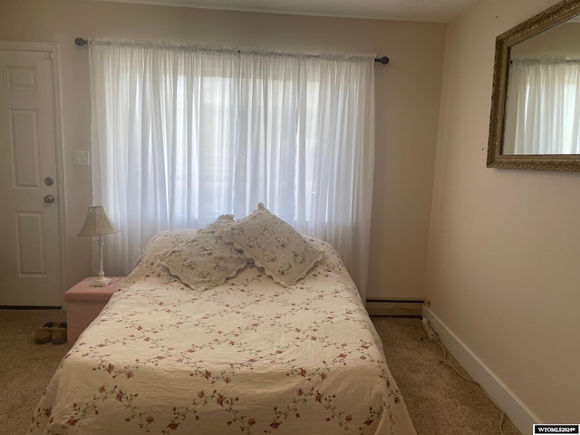 bedroom featuring light colored carpet