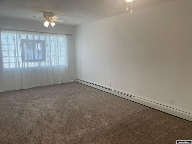 empty room with ceiling fan, carpet flooring, and a wealth of natural light