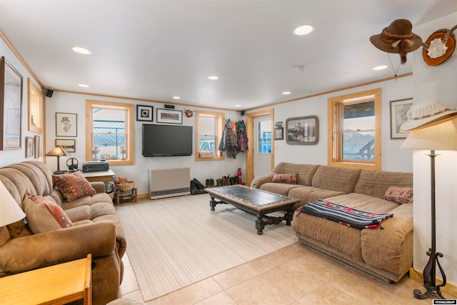 tiled living room featuring crown molding