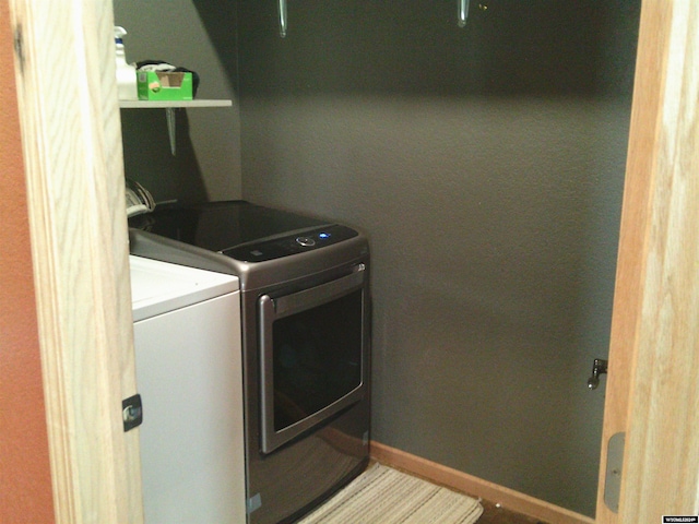 laundry room featuring washer and clothes dryer