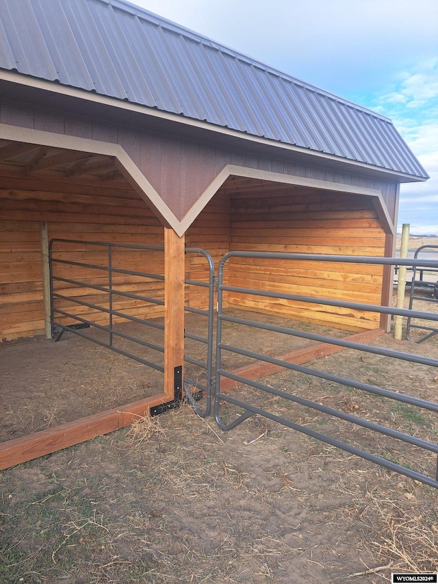 view of horse barn featuring an outdoor structure