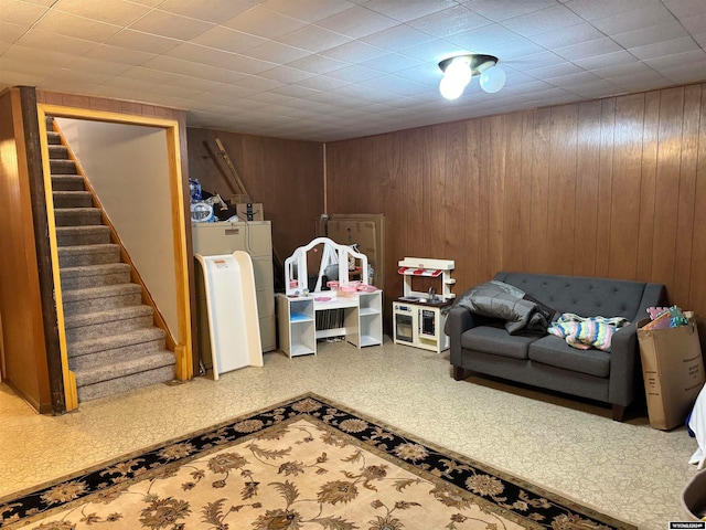 living room with wood walls