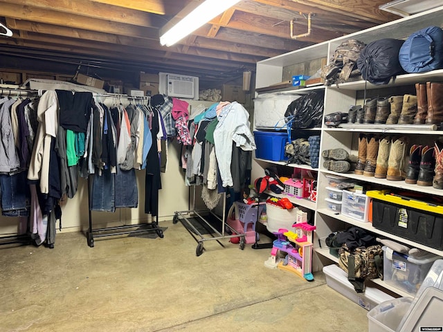 storage room featuring a wall mounted AC