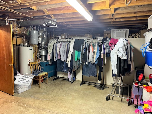 basement with a wall mounted AC and gas water heater