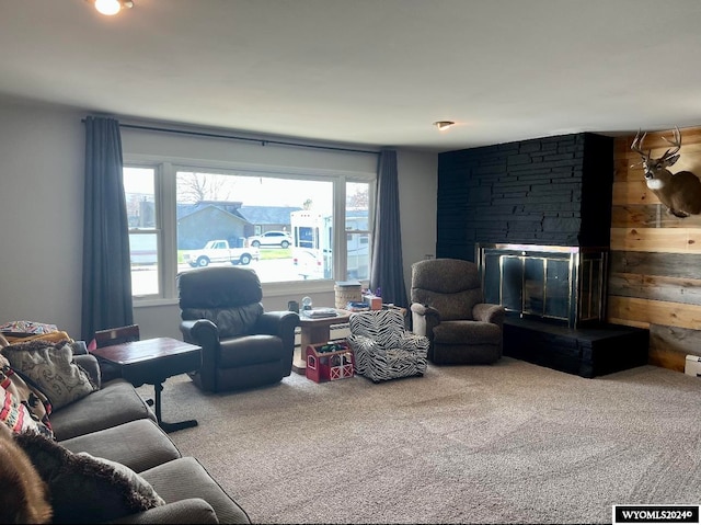 carpeted living room featuring a fireplace