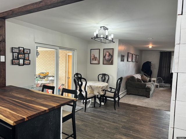 dining space with a baseboard radiator, dark hardwood / wood-style floors, and an inviting chandelier