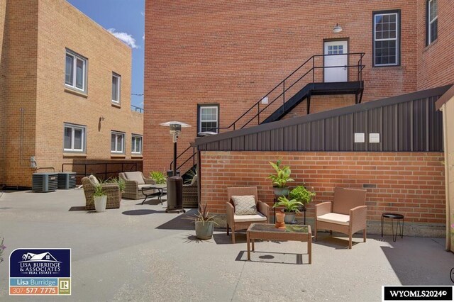 view of terrace with outdoor lounge area and central AC