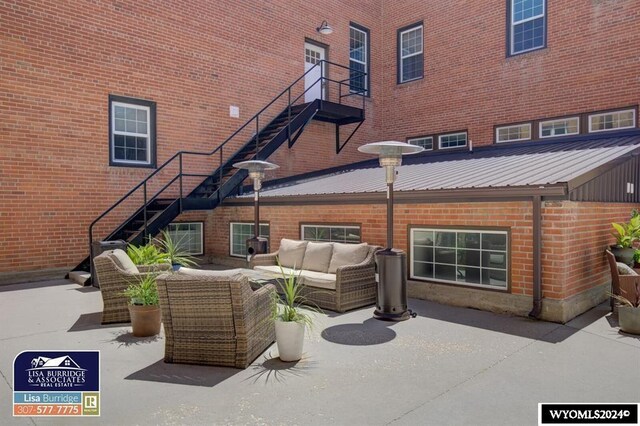 back of property with a patio and an outdoor hangout area