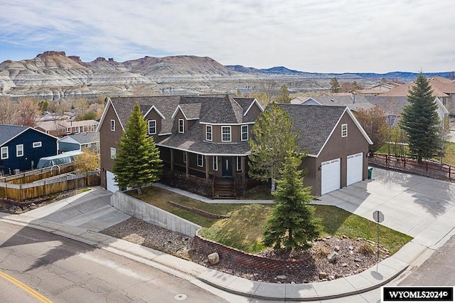 exterior space with a mountain view and a garage