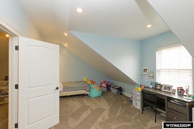 bedroom with carpet floors and vaulted ceiling