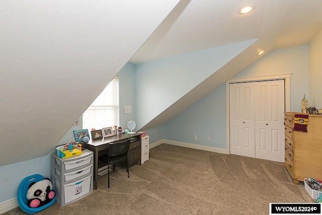 office space featuring lofted ceiling and carpet flooring