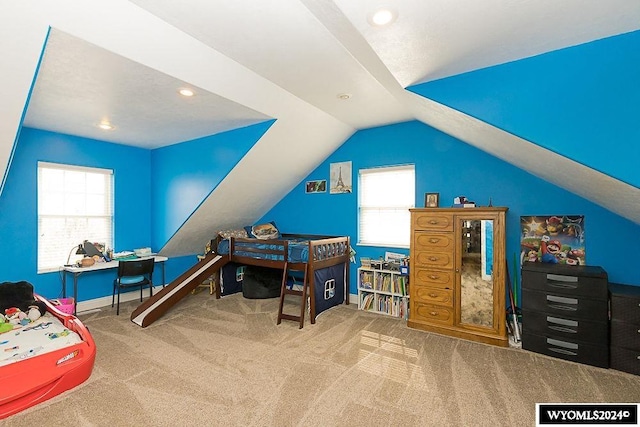 playroom with carpet flooring and lofted ceiling