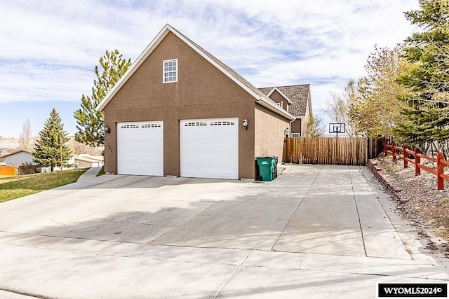 view of side of home featuring a garage