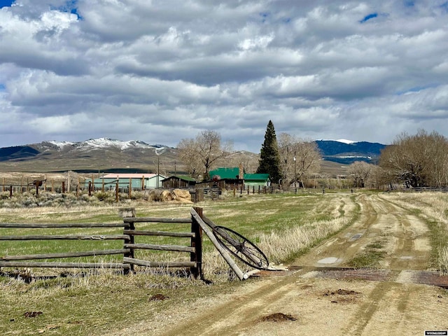 view of yard featuring a mountain view and a rural view