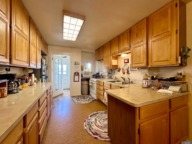 kitchen with white appliances and sink