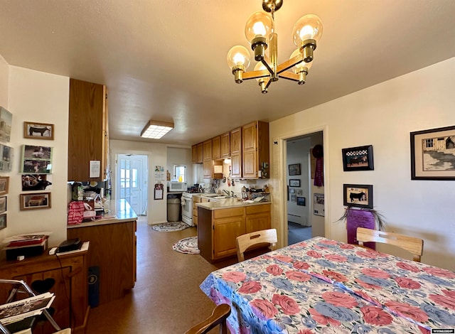 interior space featuring sink and a chandelier