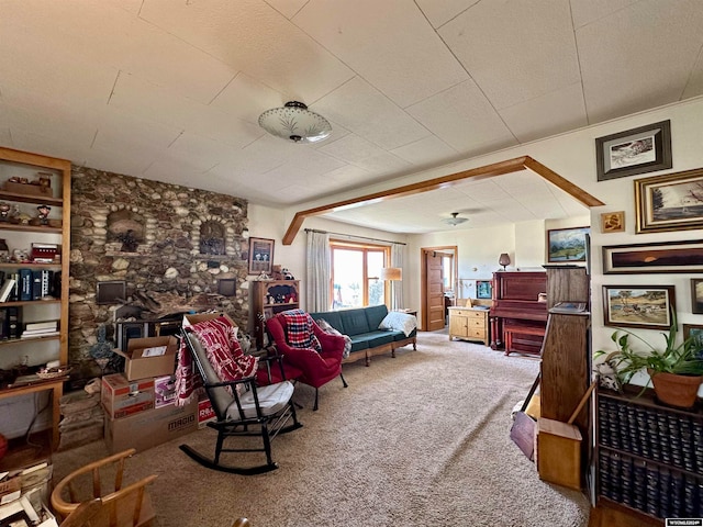 living area with carpet flooring and a fireplace