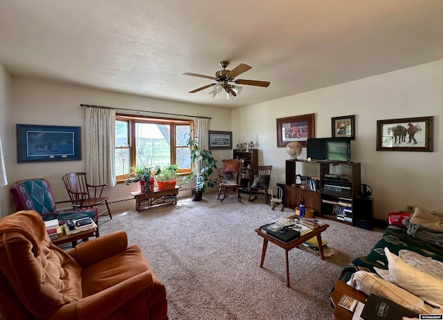 carpeted living room featuring a textured ceiling and ceiling fan