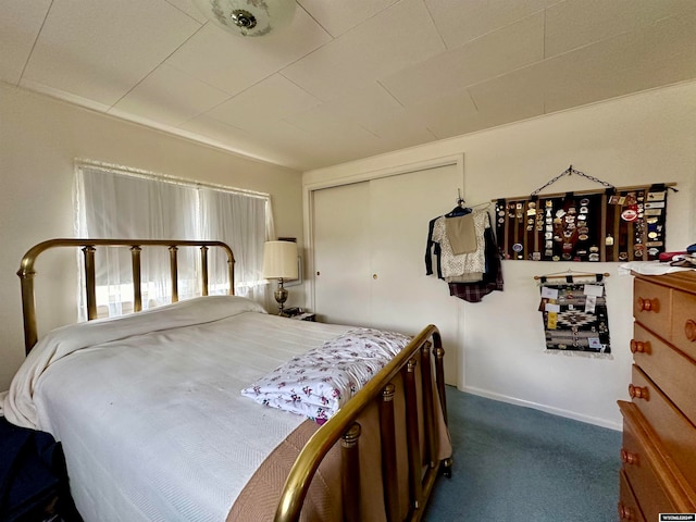 carpeted bedroom featuring a closet