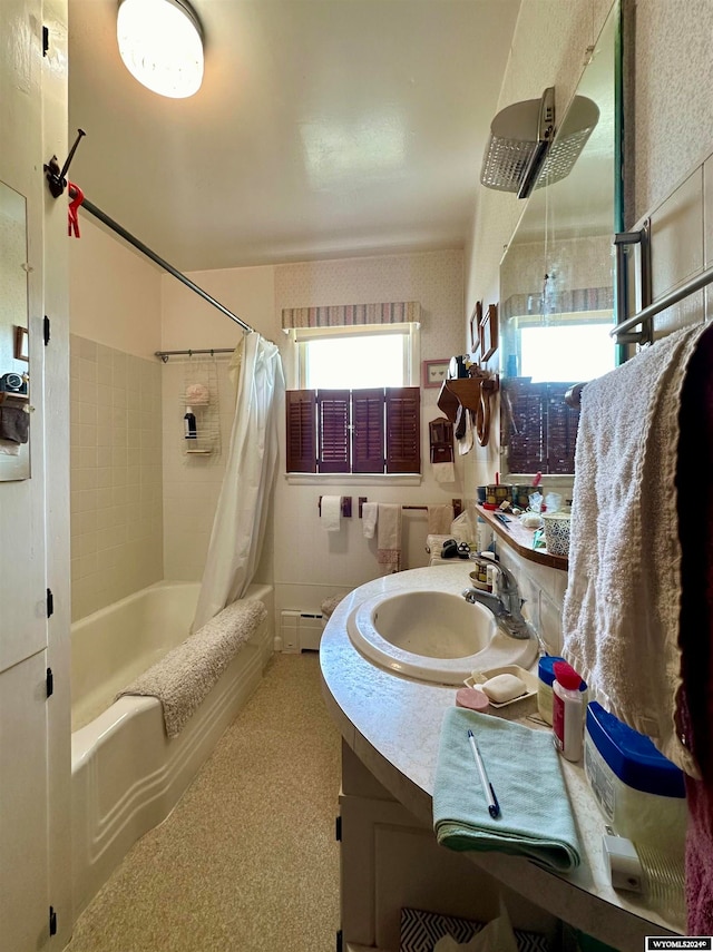 bathroom featuring vanity, shower / bath combination with curtain, and baseboard heating