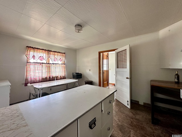 kitchen with dark tile flooring