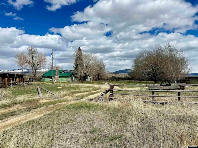 view of yard with a rural view